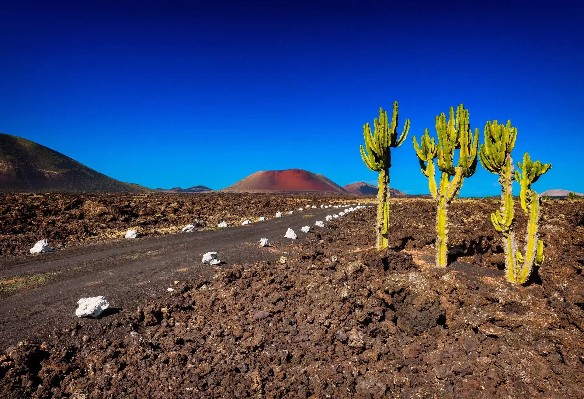 Road in the Fire Mountains, part of Timanfaya National Park, Lanzarote, Canary Islands, Spain.