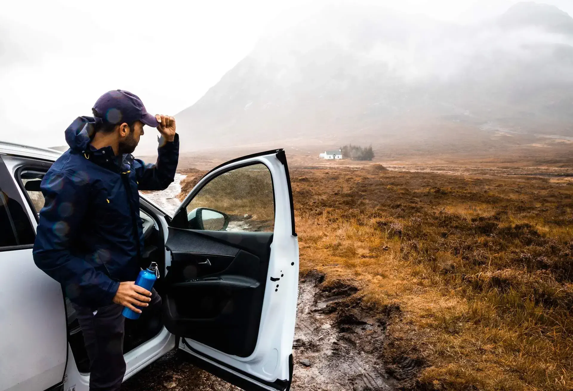 Driving off road with mud and rain in Scotland.