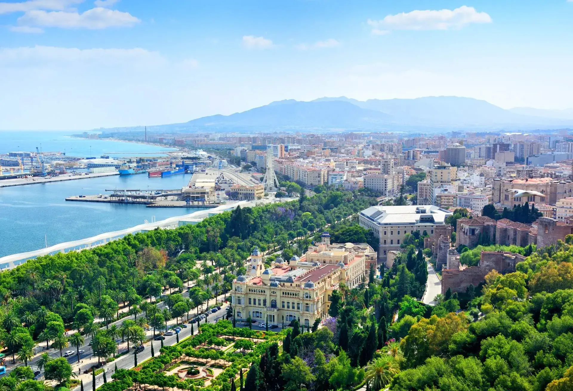 Malaga cityscape with Cathedral of Malaga and harbor, Spain