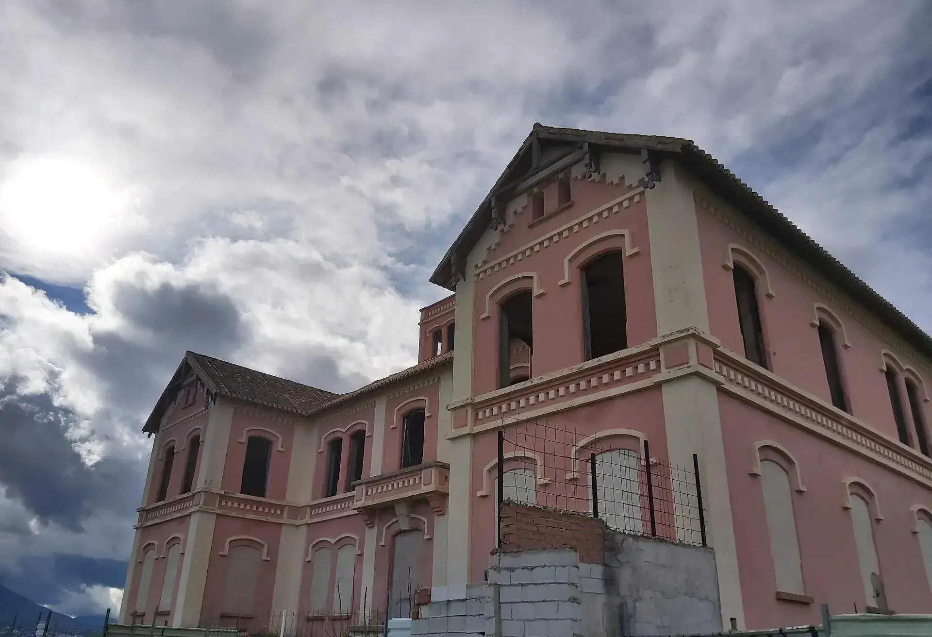 El Cortijo Jurado. Church, mansion and future hotel abandoned for years by mysteries and ghosts. Pink Church with chapel and giant basement. Very old Spanish church with many stories. Many windows and rooms in Malaga, Spain.