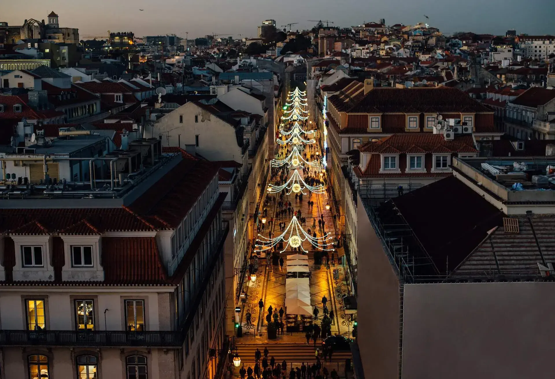 Rua Augusta street in Lisbon illuminated with decoration with words in French and Spanish