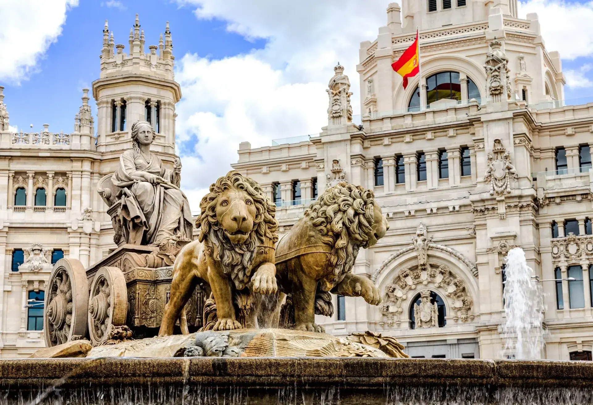 The Plaza de Cibeles is a square with a neo-classical complex of marble sculptures with fountains that has become an iconic symbol for the city of Madrid.