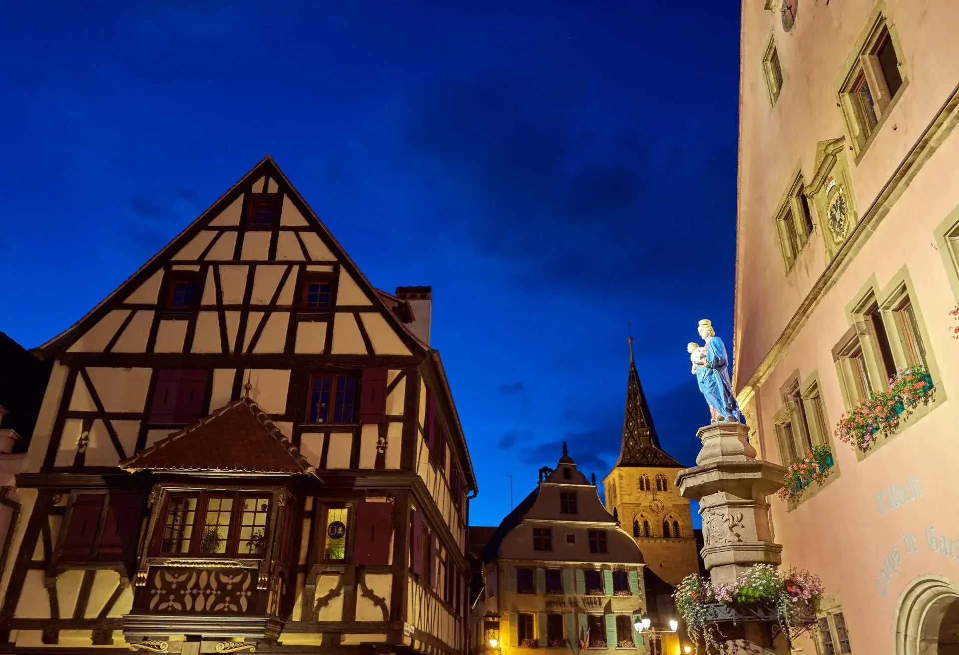 France, Alsace, Turckheim, 15.06.2017, Night view towards the town hall and the church of St-Anne