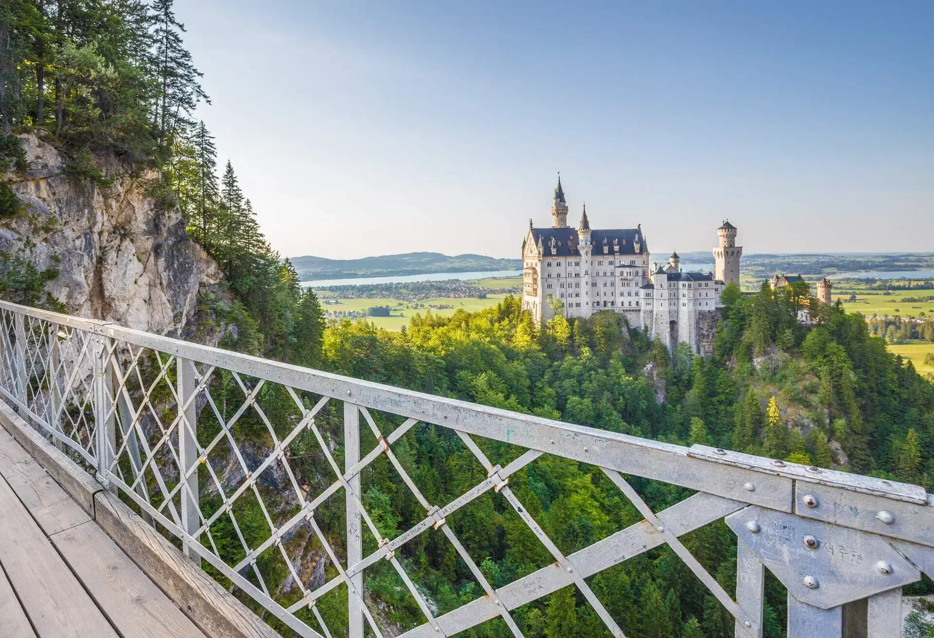 Beautiful view of world-famous Neuschwanstein Castle, the 19th century Romanesque Revival palace built for King Ludwig II, in evening light at sunset seen from Marienbrucke, Allgau, Bavaria, Germany; Shutterstock ID 465693332