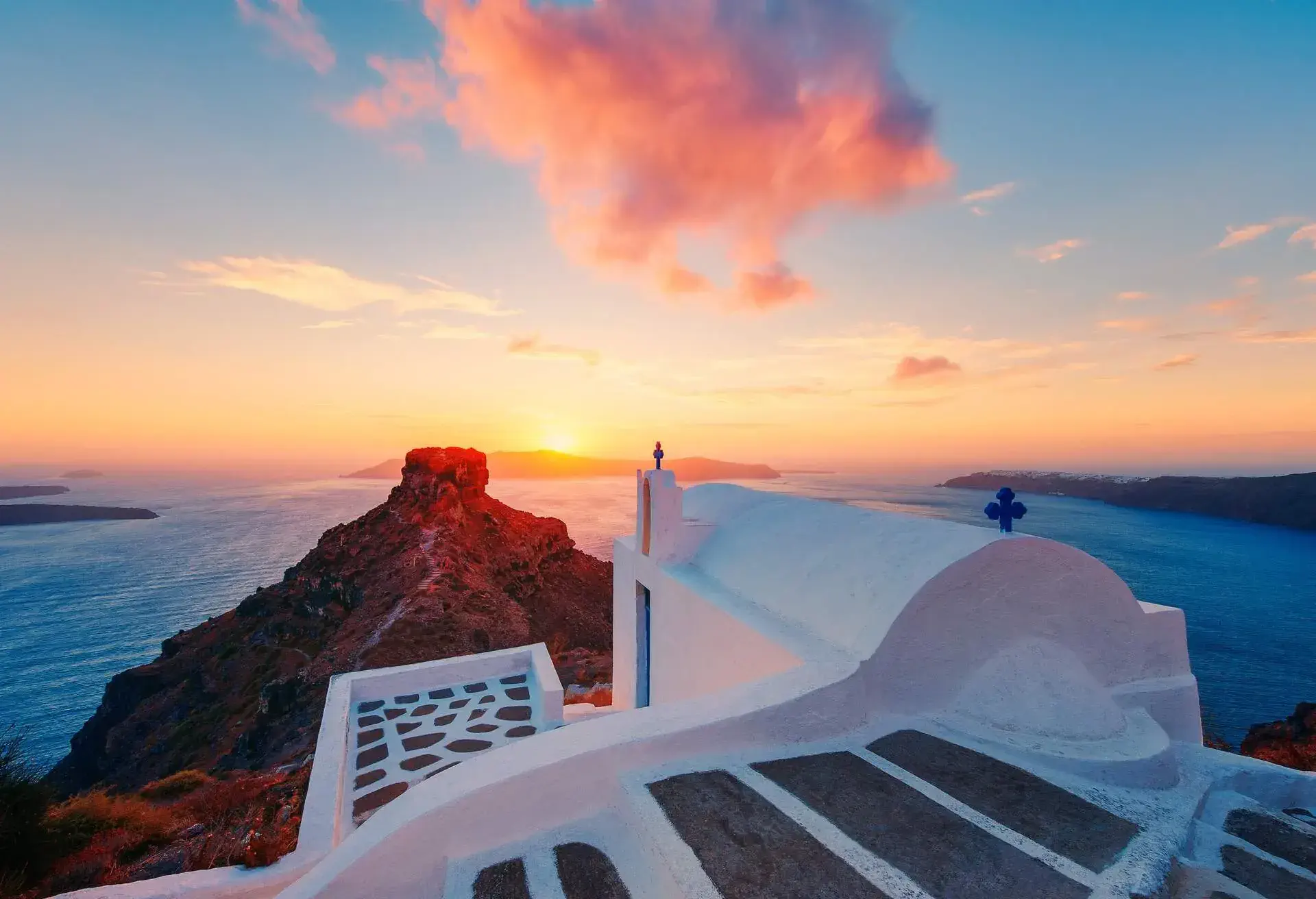 Sunset at Skaros Rock in Santorini, Cyclades Islands, Greece.