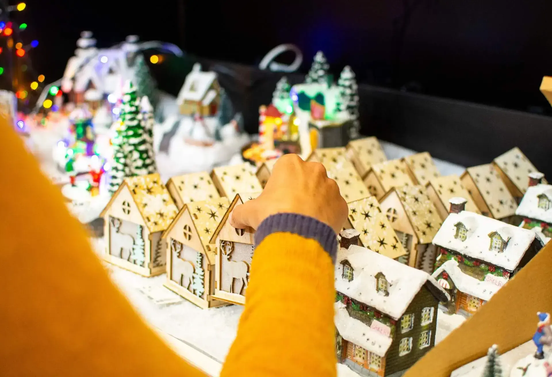 back view of woman looking at christmas decorations at christmas market