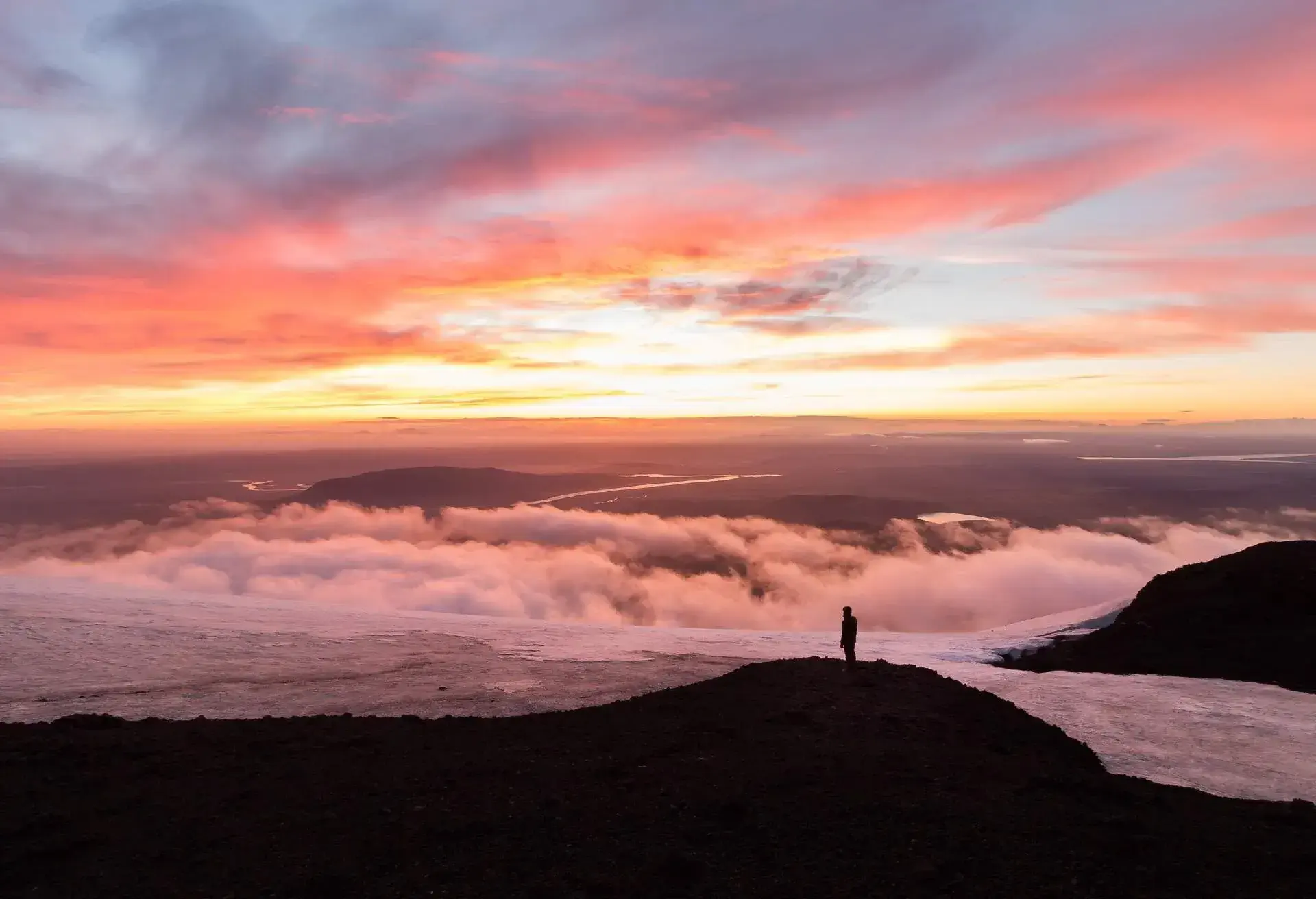 Silhouette of hiking man in mountain (Hekla stratovolcano in the south of Iceland)